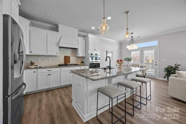 a living room with furniture a rug and a fireplace