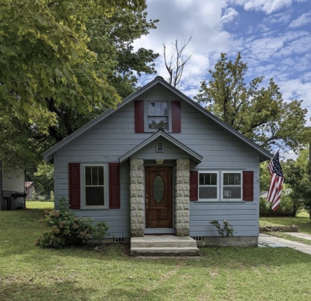962 3rd Street Tracy City, TN 37387 - Photo 22 of 35 a front view of a house with a yard garage and outdoor seating