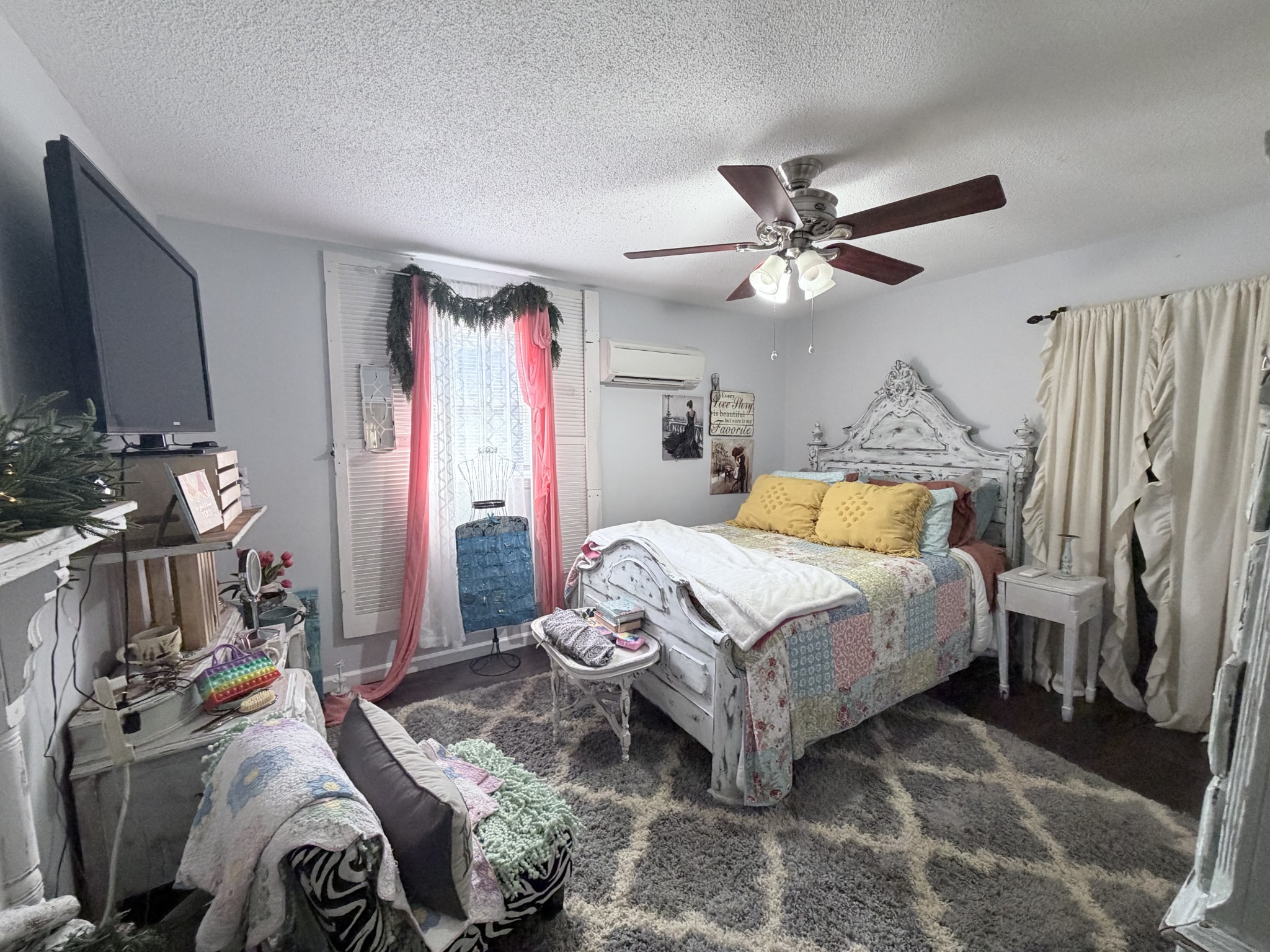 962 3rd Street Tracy City, TN 37387 - Photo 33 of 35 a bedroom with a bed and a chandelier