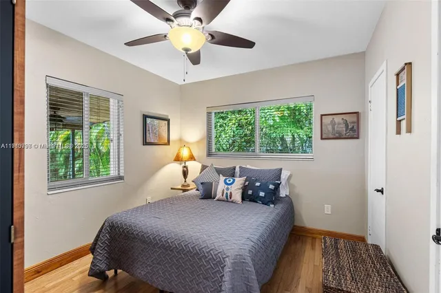 a bed room with a bed and a window