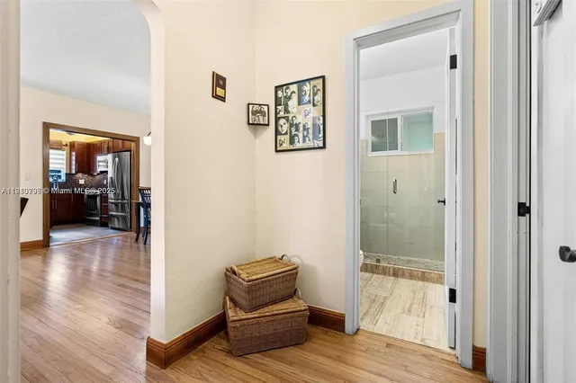 a view of room with furniture and wooden floor