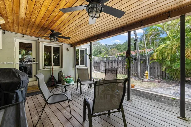 a patio with yard glass top table and chairs