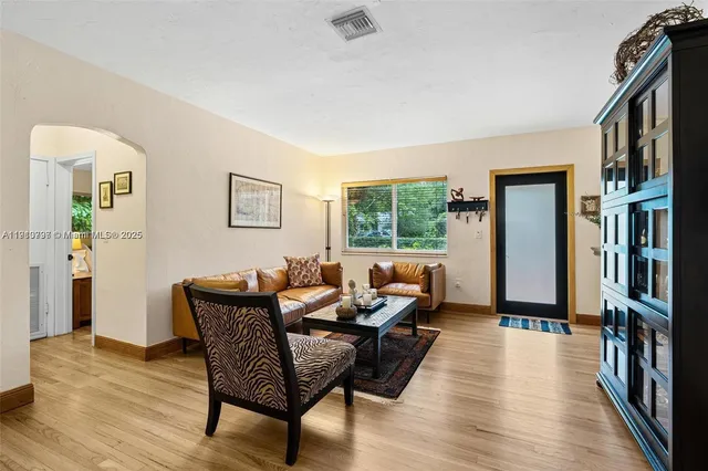 a living room with furniture and a window