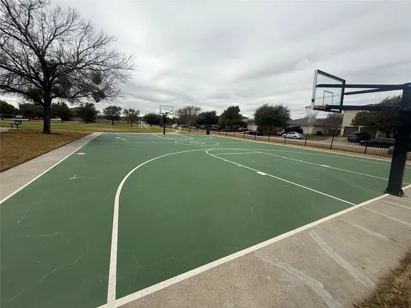 a basketball court with view of buildings