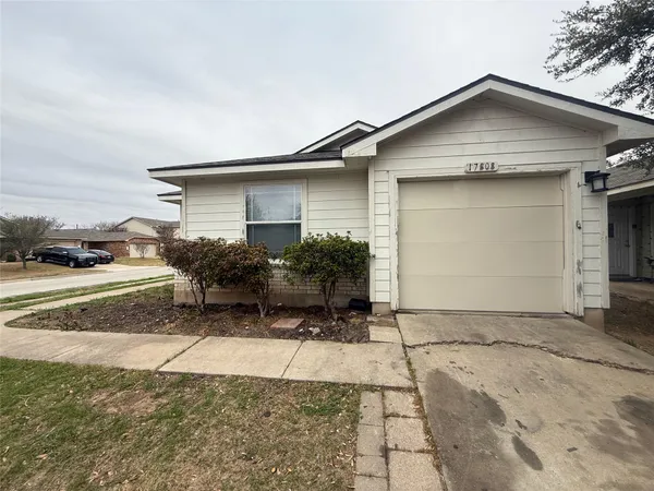 a small white house with a outdoor space