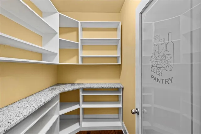 a reading room with furniture and wooden floor