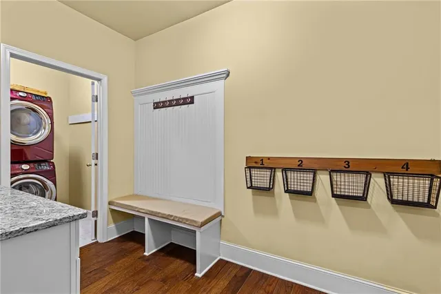 a view of an entryway with wooden floor and stairs