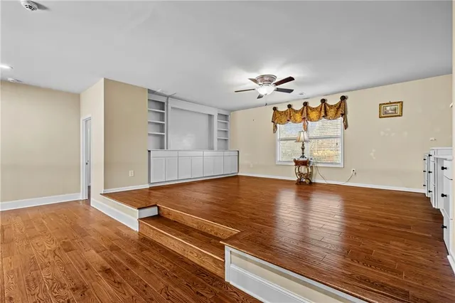 a view of a livingroom with a ceiling fan