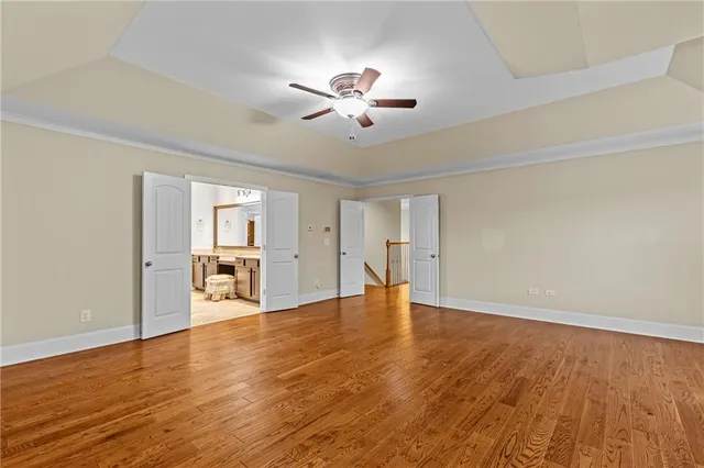 a spacious bathroom with a sink a counter top and a toilet