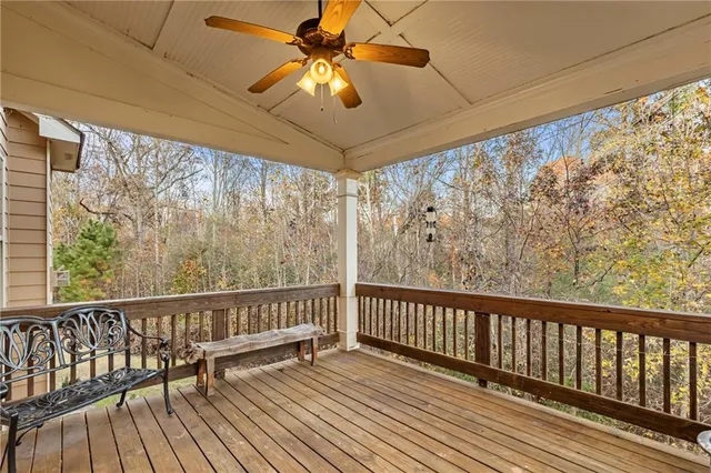 a view of a balcony with wooden floor