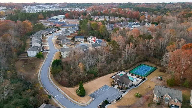 an aerial view of a house with outdoor space
