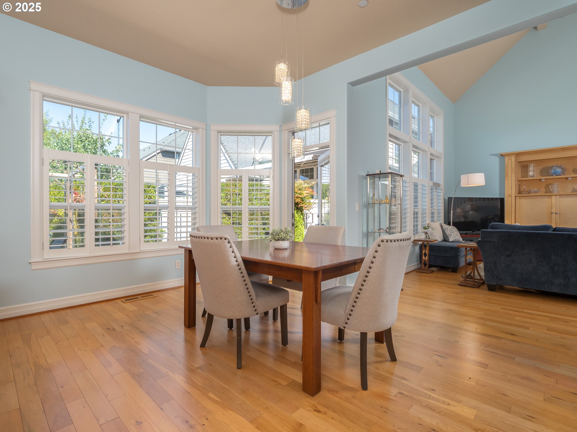 3866 Oak Meadows Loop Newberg, OR 97132 - Photo 11 of 48 a view of a dining room with furniture windows and wooden floor