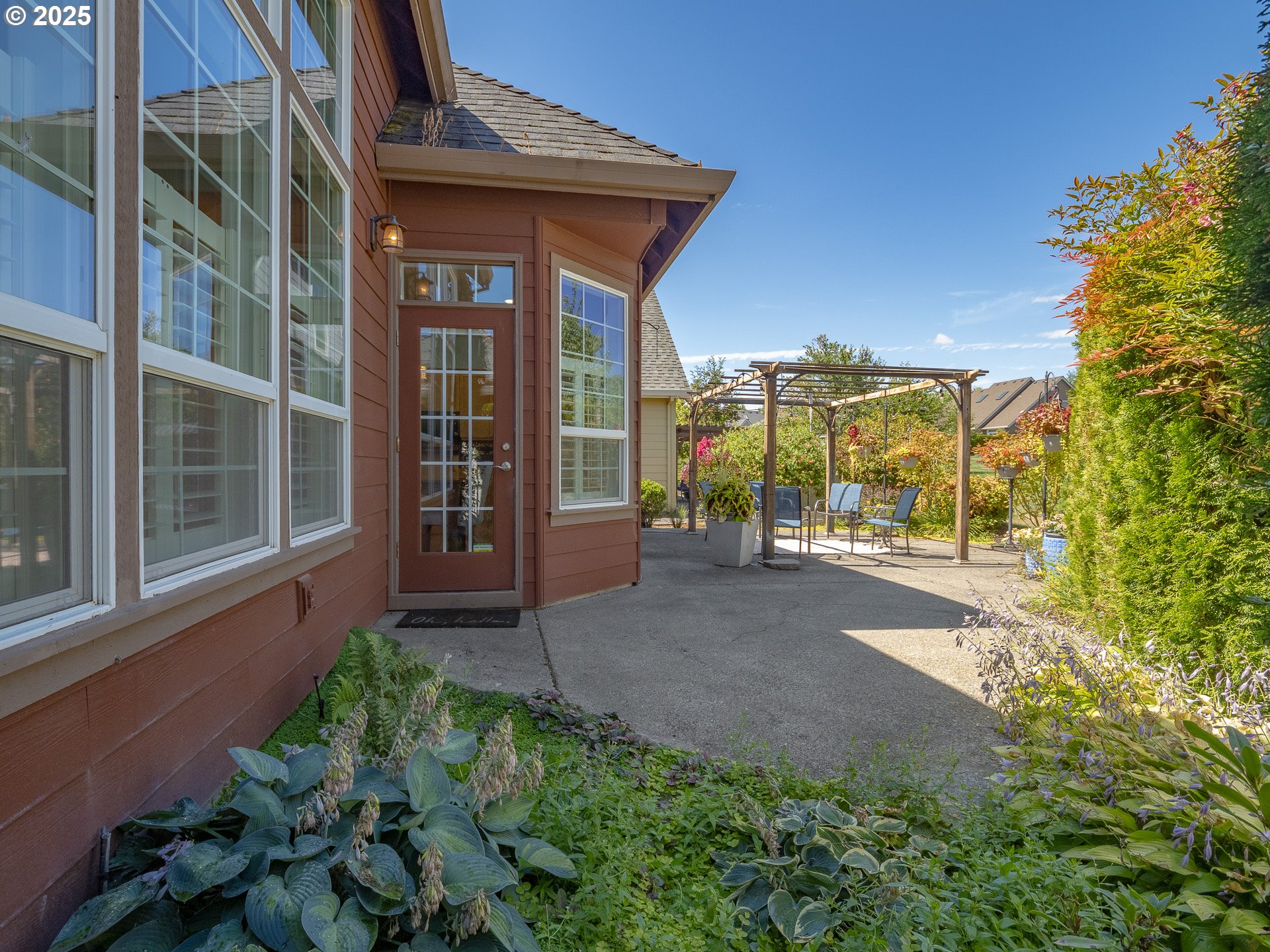 3866 Oak Meadows Loop Newberg, OR 97132 - Photo 13 of 48 a view of a house with a garden