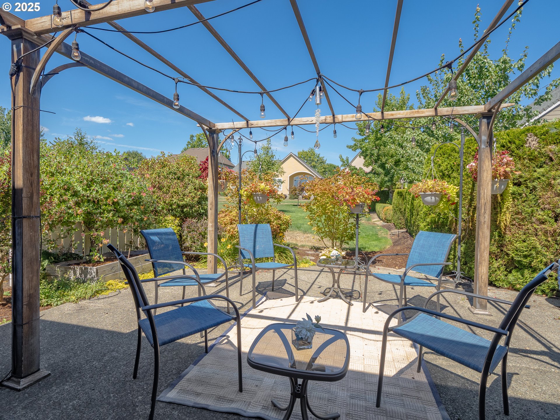 3866 Oak Meadows Loop Newberg, OR 97132 - Photo 14 of 48 a patio with yard glass top table and chairs