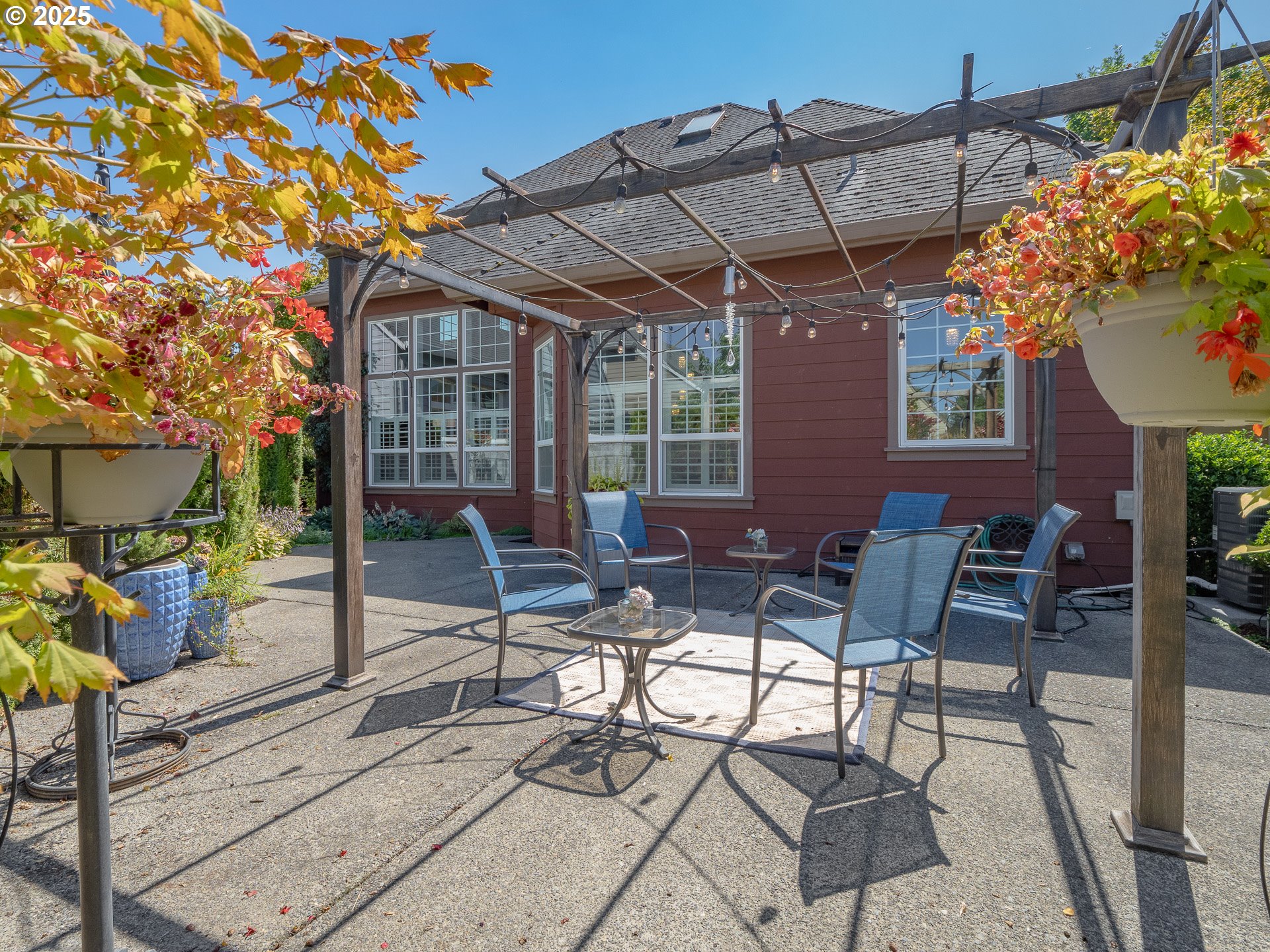 3866 Oak Meadows Loop Newberg, OR 97132 - Photo 15 of 48 a view of patio with a table and chairs and potted plants