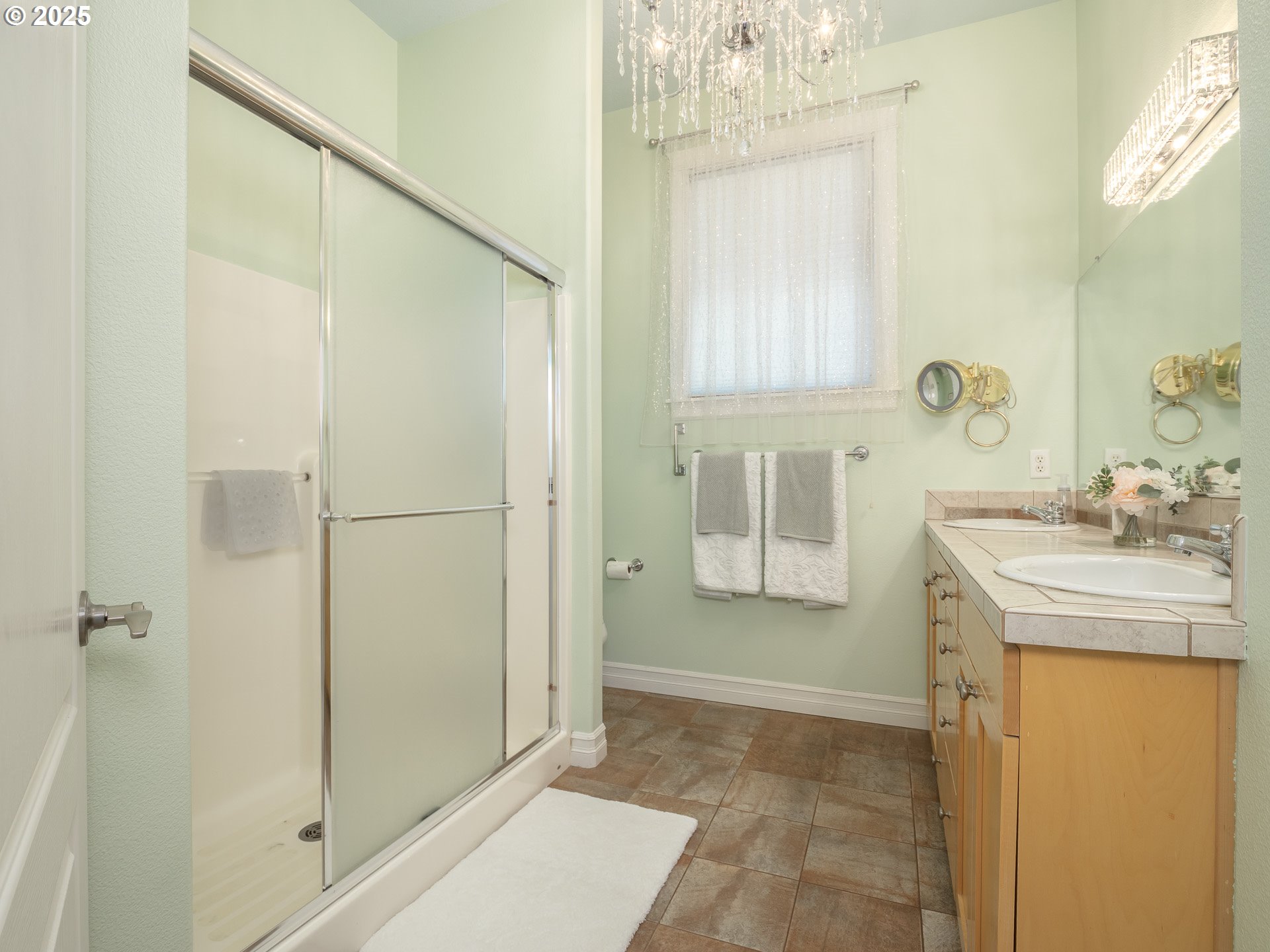 3866 Oak Meadows Loop Newberg, OR 97132 - Photo 24 of 48 a bathroom with a granite countertop shower a mirror and a sink