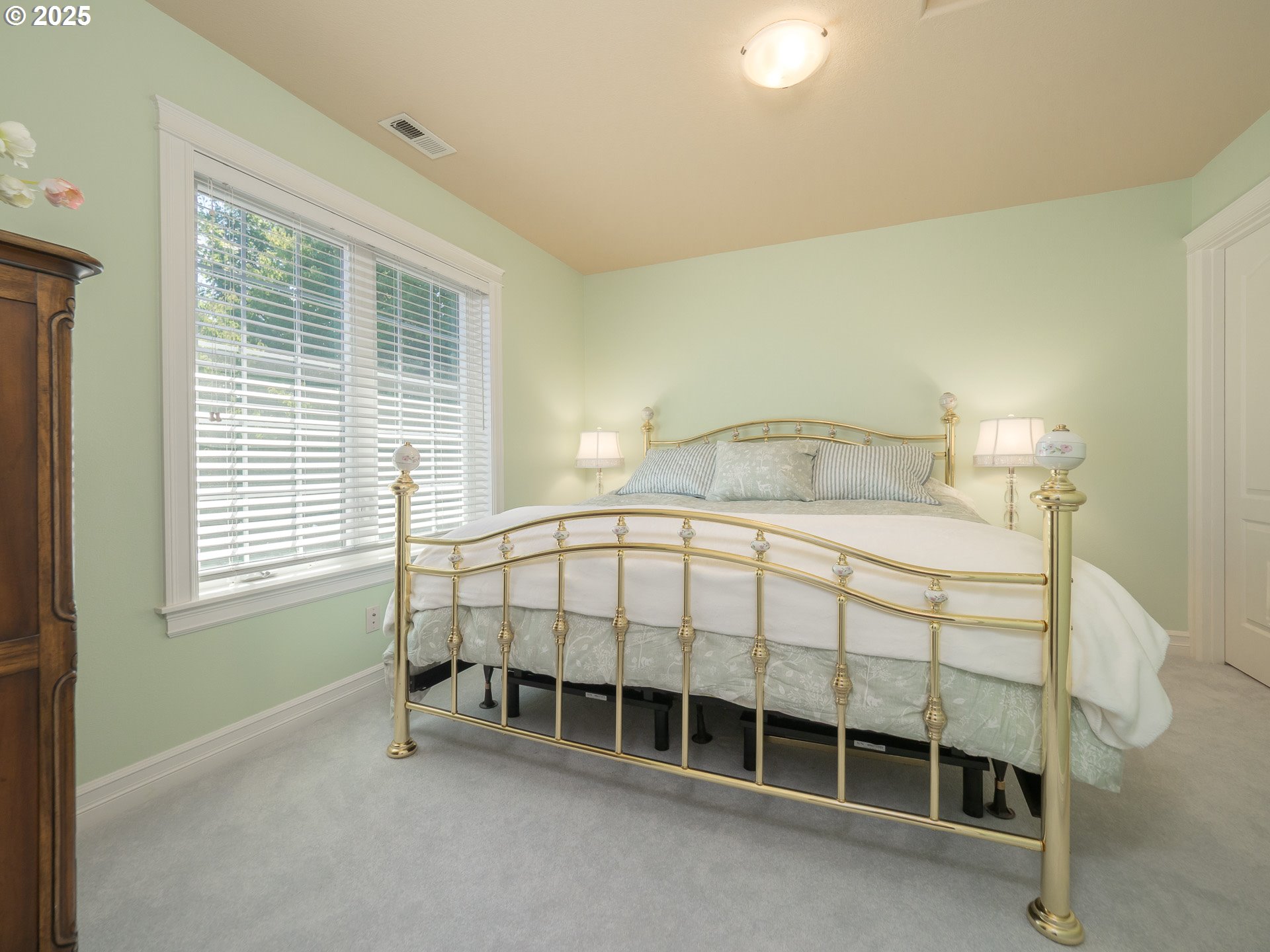 3866 Oak Meadows Loop Newberg, OR 97132 - Photo 34 of 48 a bed sitting in a bedroom next to a window