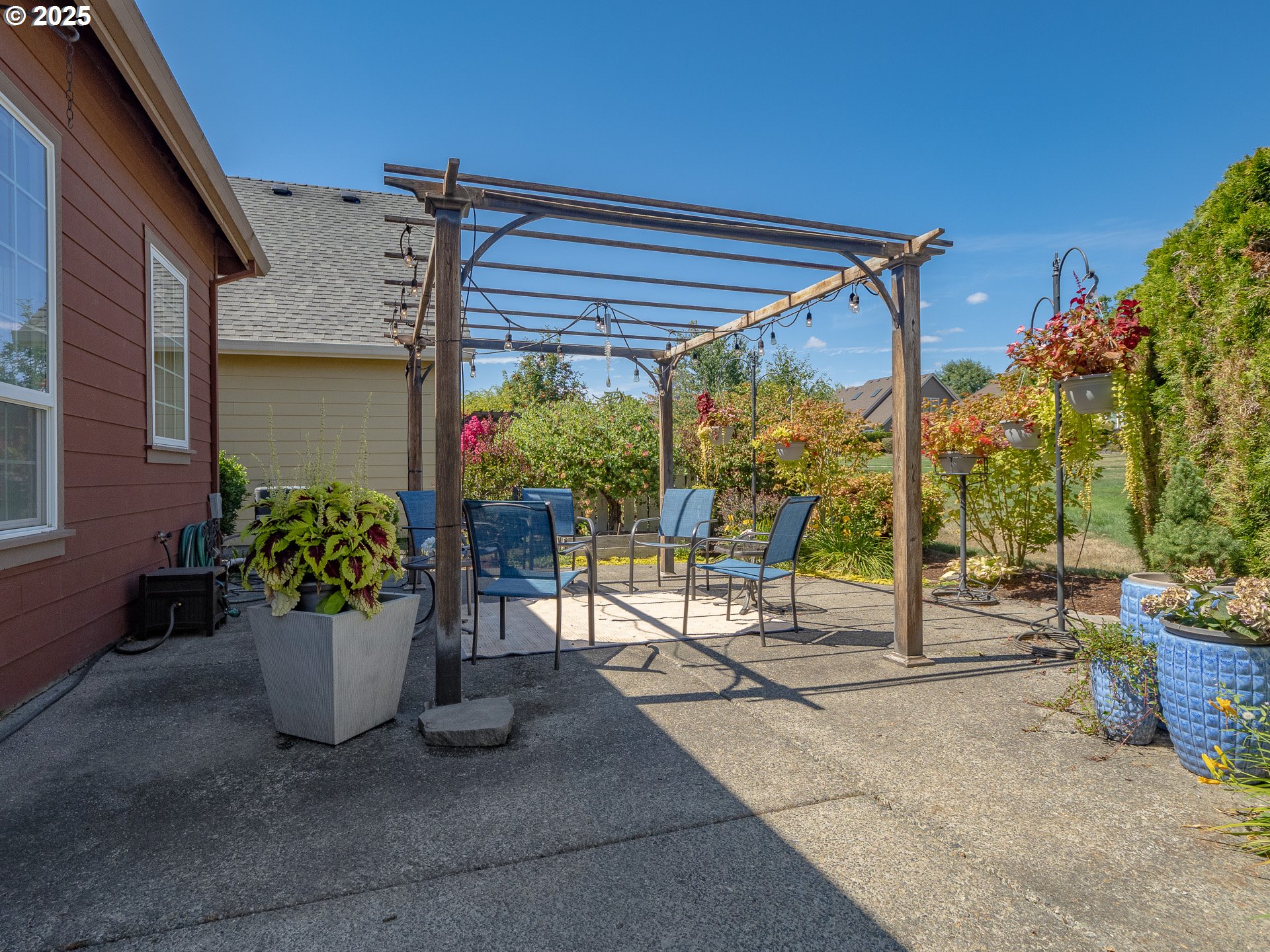 3866 Oak Meadows Loop Newberg, OR 97132 - Photo 36 of 48 a view of a porch with potted plants