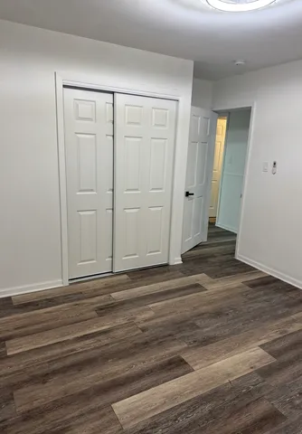 a view of a livingroom with wooden floor