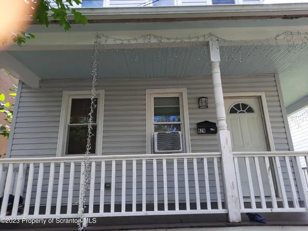 a view of a brick house with a window