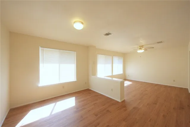 a view of an empty room with a window