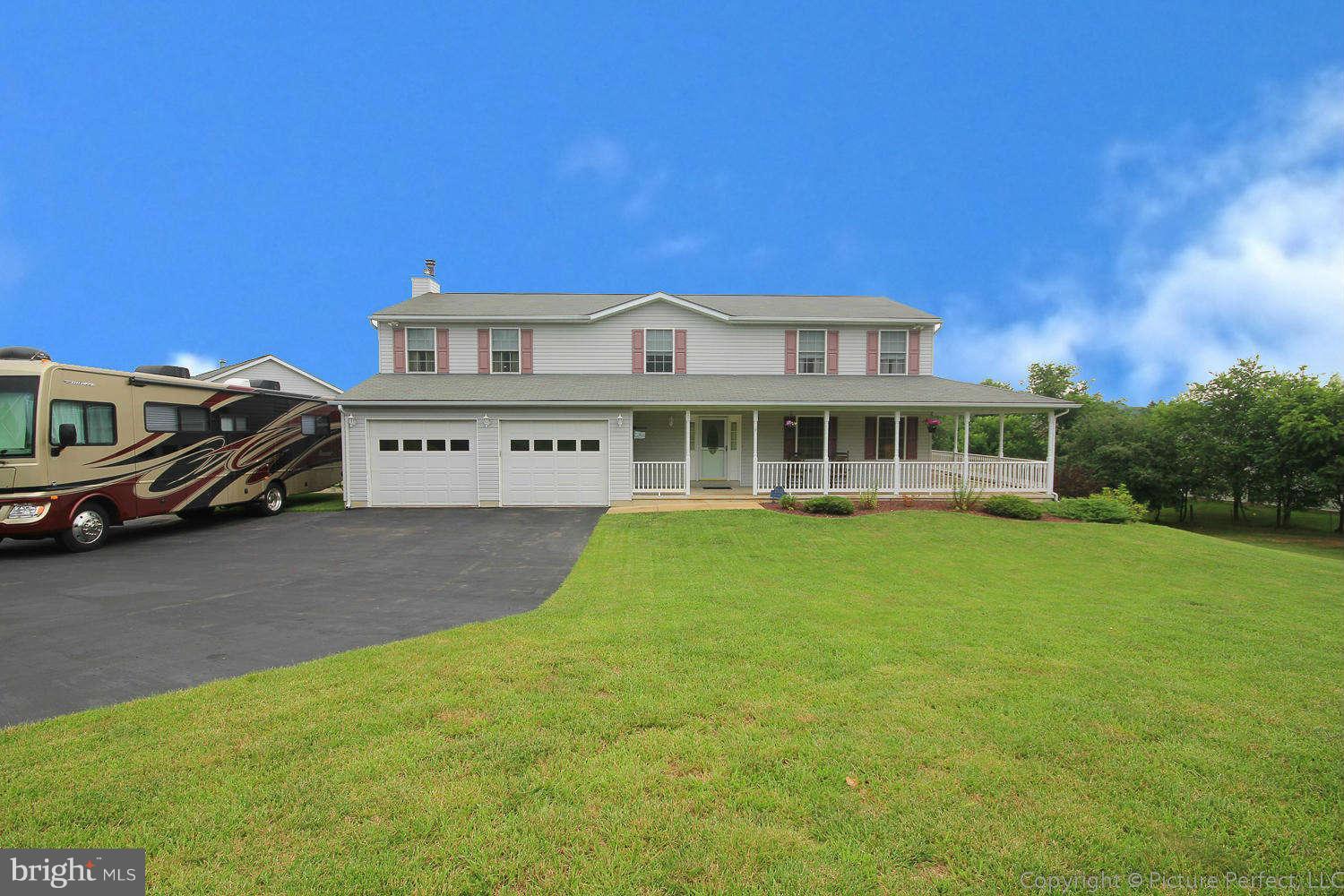 13132 Jesse Smith Road Mount Airy, MD 21771 - Photo 2 of 30 a front view of a house with a garden