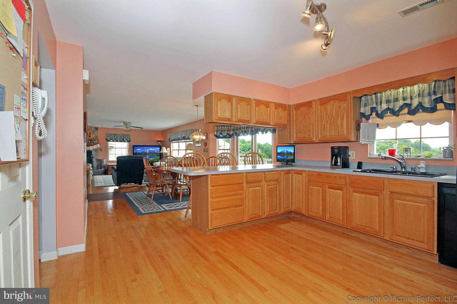 13132 Jesse Smith Road Mount Airy, MD 21771 - Photo 11 of 30 a kitchen with stainless steel appliances granite countertop a stove and cabinets