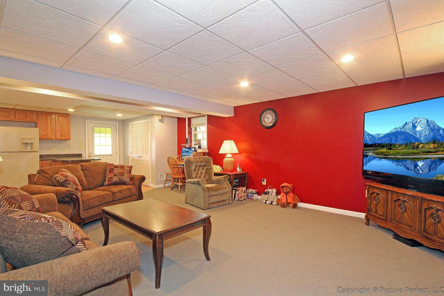 13132 Jesse Smith Road Mount Airy, MD 21771 - Photo 26 of 30 a living room with furniture pool table and a flat screen tv