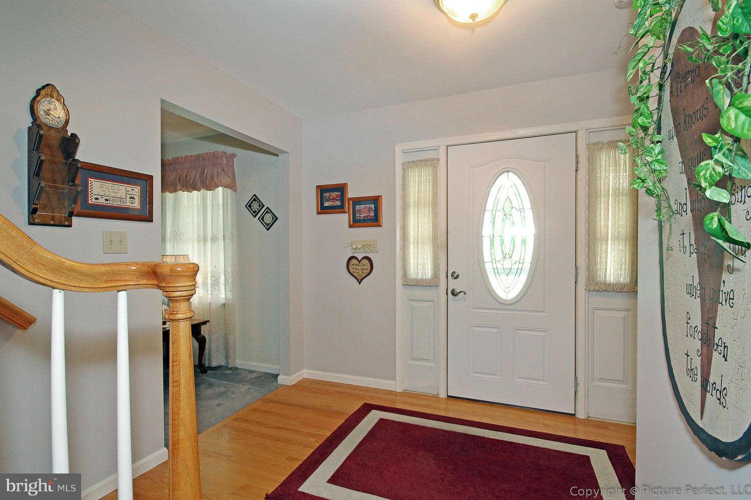 13132 Jesse Smith Road Mount Airy, MD 21771 - Photo 4 of 30 a view of a livingroom with furniture and entryway