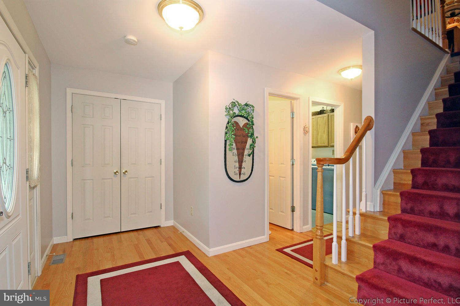 13132 Jesse Smith Road Mount Airy, MD 21771 - Photo 5 of 30 a view of an entryway with wooden floor and mirror
