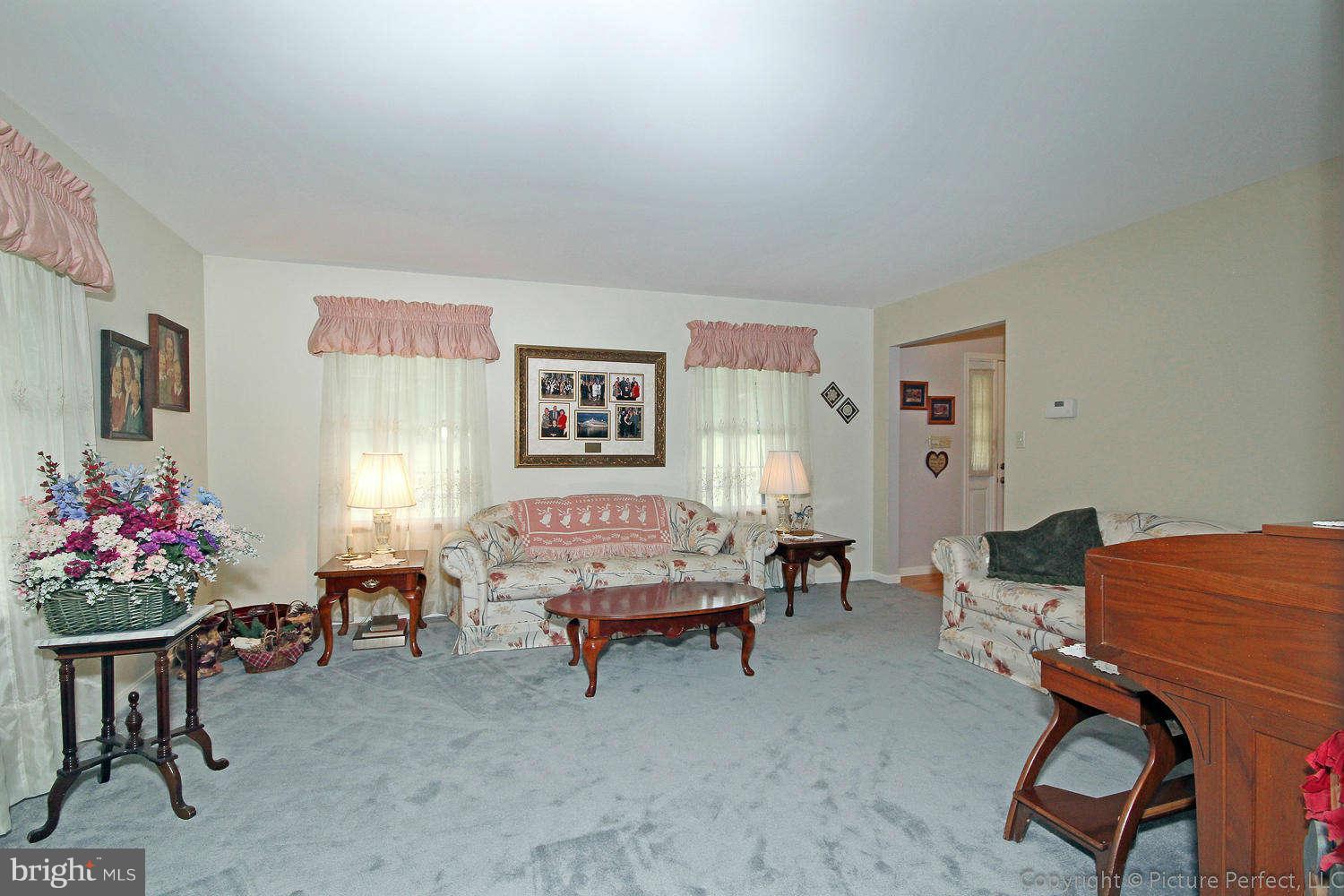 13132 Jesse Smith Road Mount Airy, MD 21771 - Photo 9 of 30 a bedroom with furniture and a chair