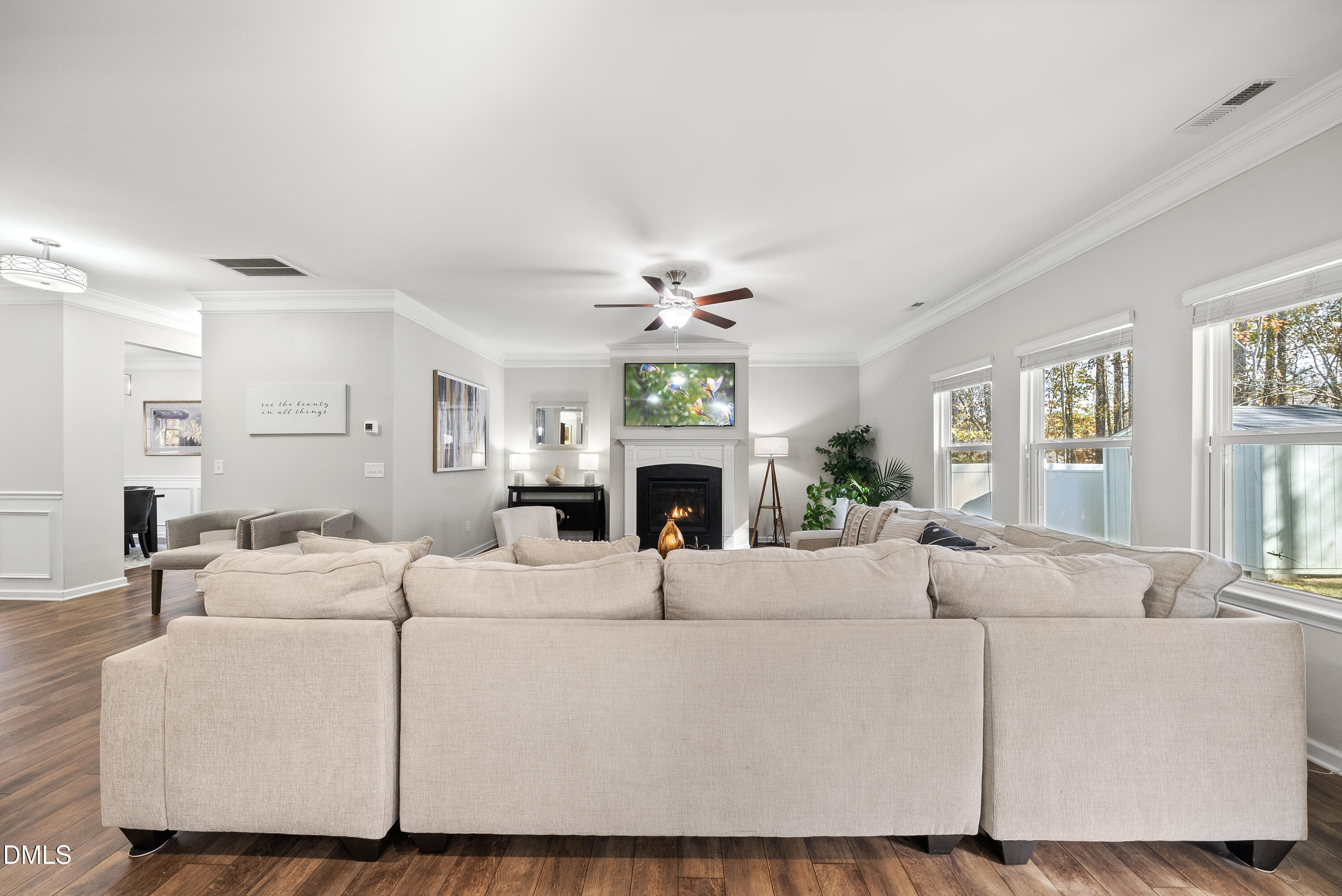 306 Springhill Lane Garner, NC 27529 - Photo 10 of 43 a living room with furniture a fireplace and a window