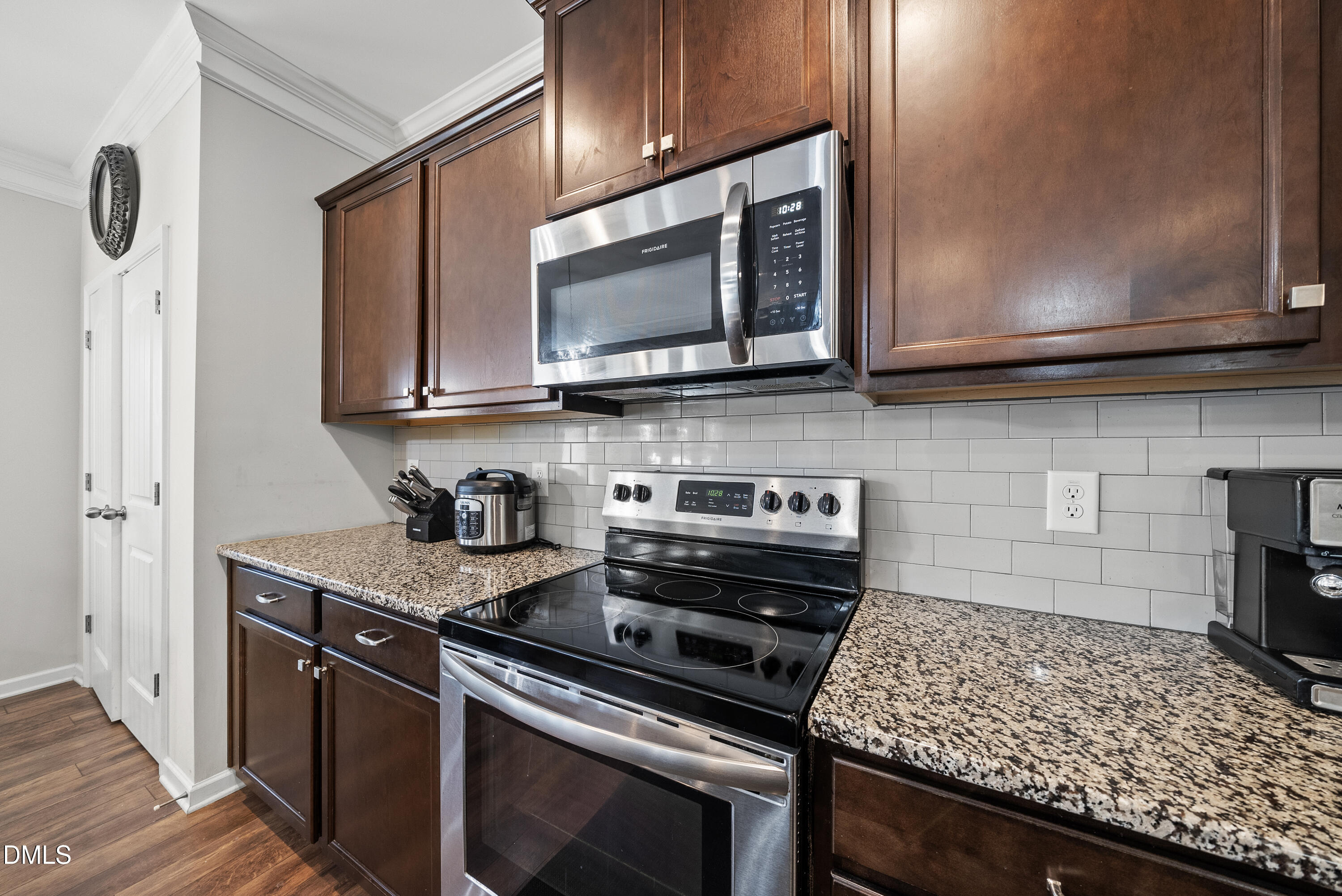 306 Springhill Lane Garner, NC 27529 - Photo 17 of 43 a kitchen with a stove and a microwave