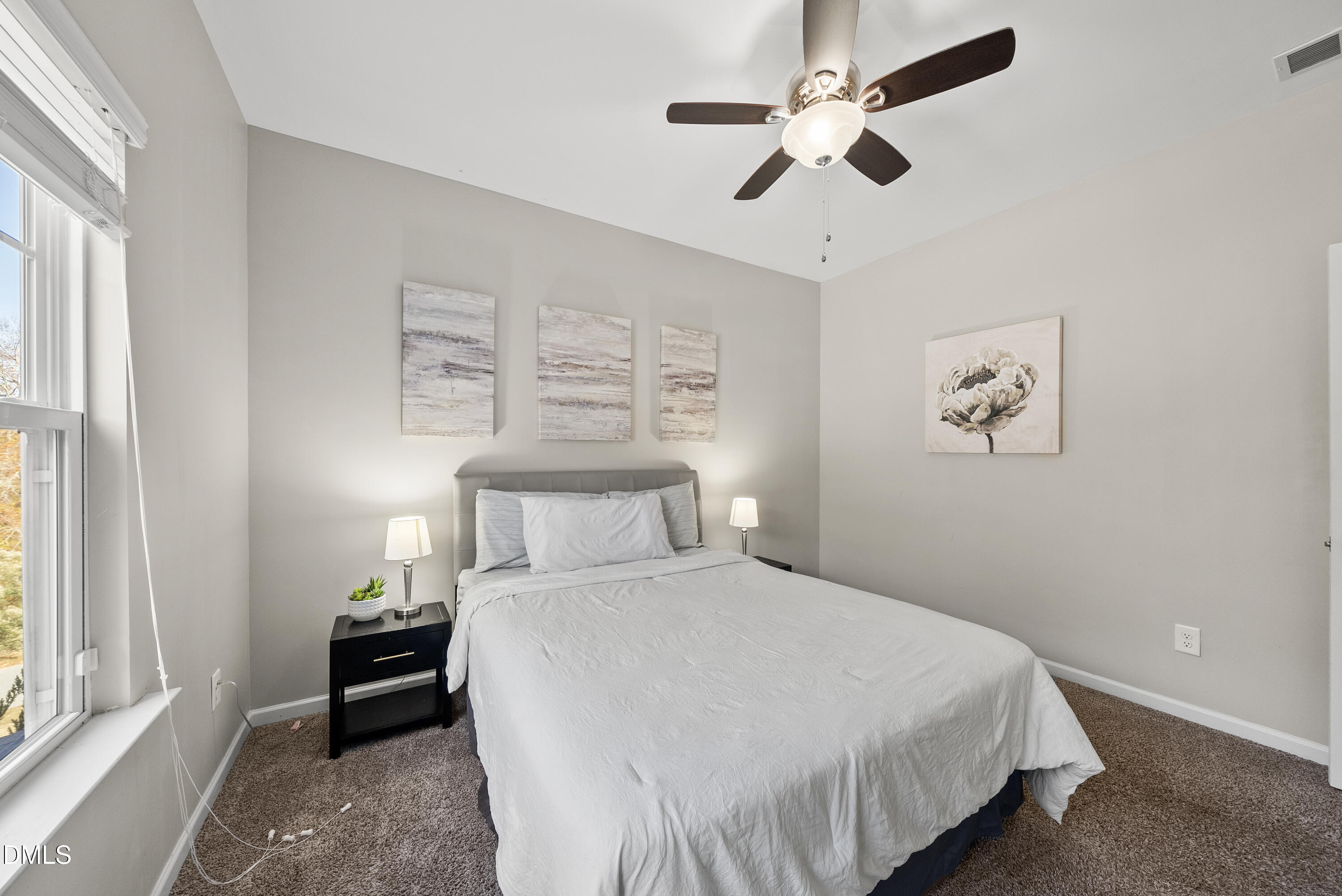 306 Springhill Lane Garner, NC 27529 - Photo 27 of 43 a bedroom with a bed and a window