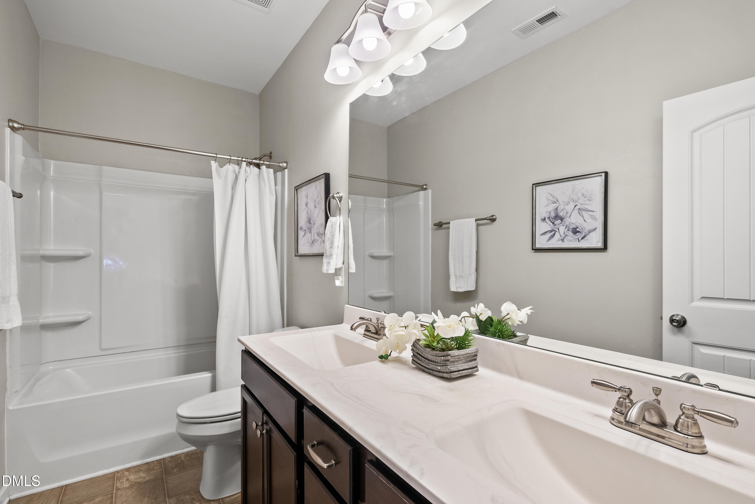 306 Springhill Lane Garner, NC 27529 - Photo 28 of 43 a bathroom with a granite countertop sink a toilet and a bathtub