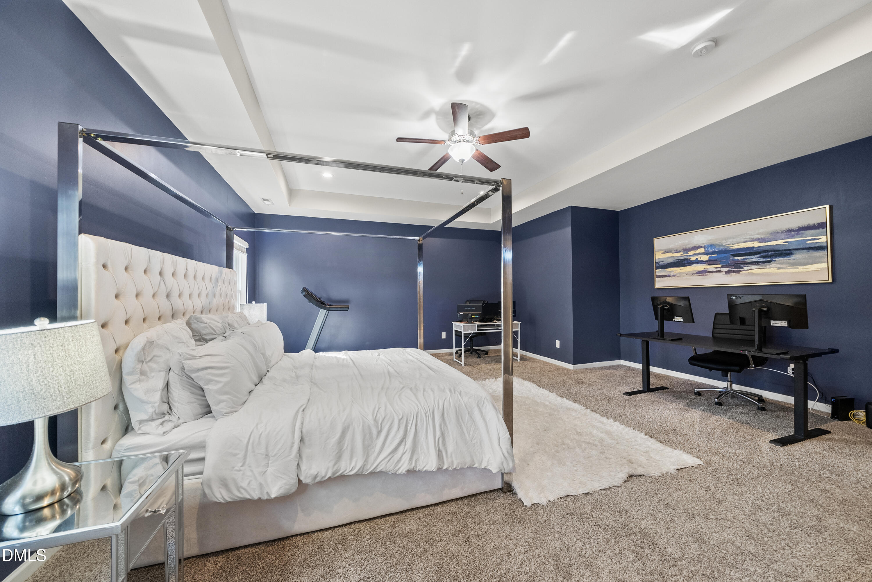 306 Springhill Lane Garner, NC 27529 - Photo 31 of 43 a bedroom with furniture and a chandelier