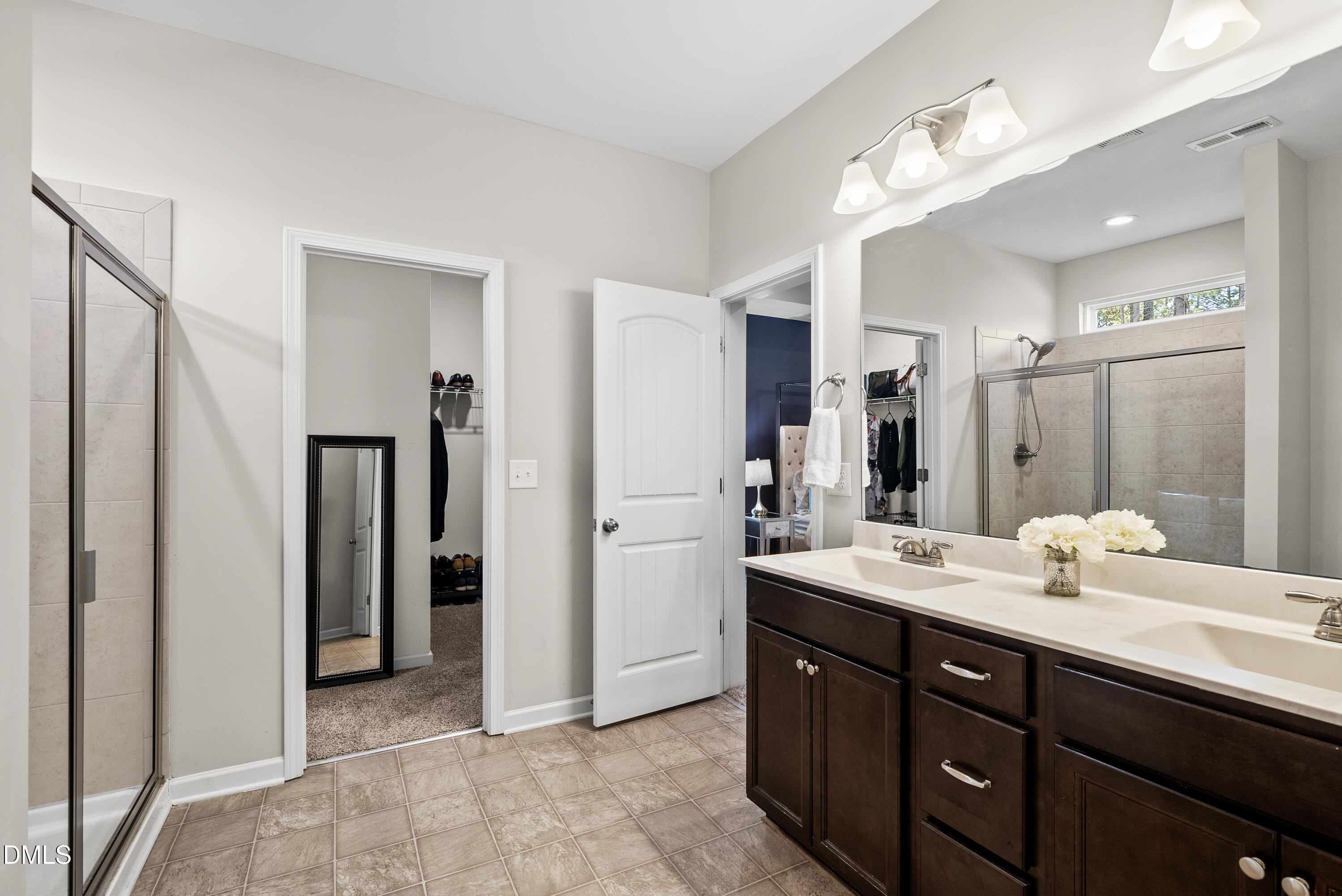 306 Springhill Lane Garner, NC 27529 - Photo 33 of 43 a bathroom with a double vanity sink mirror and double