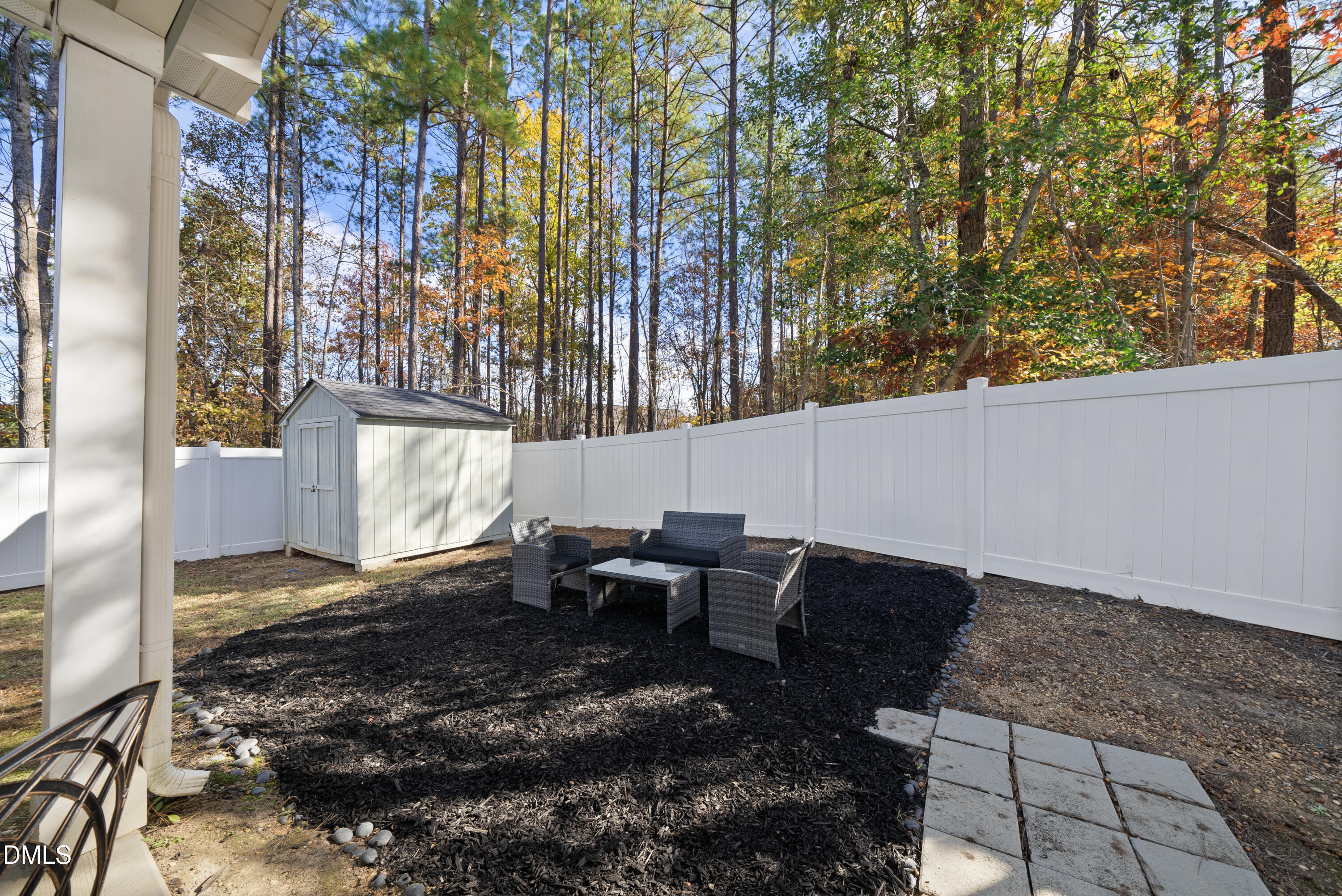 306 Springhill Lane Garner, NC 27529 - Photo 39 of 43 a backyard of a house with table and chairs