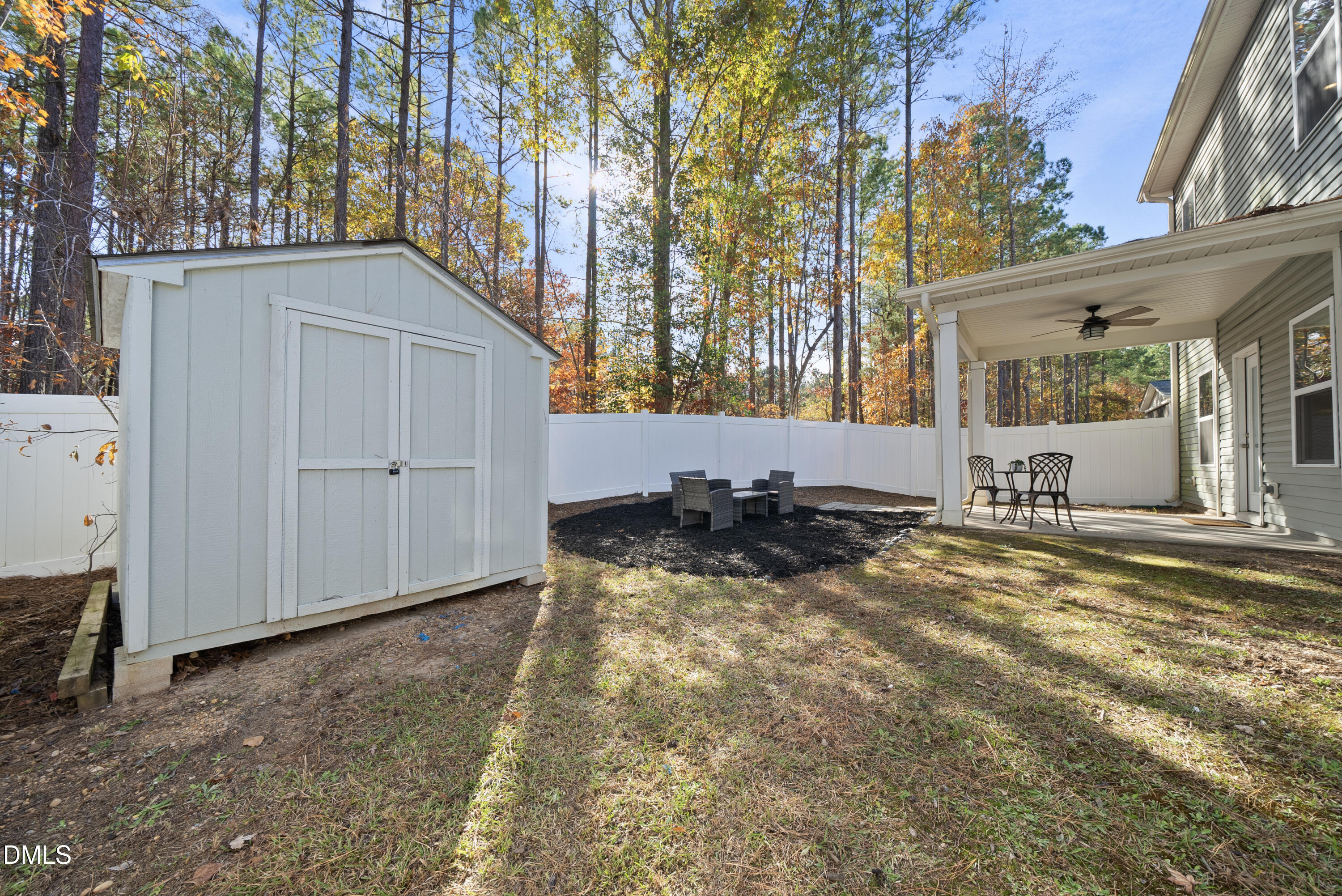 306 Springhill Lane Garner, NC 27529 - Photo 40 of 43 a view of a house with backyard and sitting area