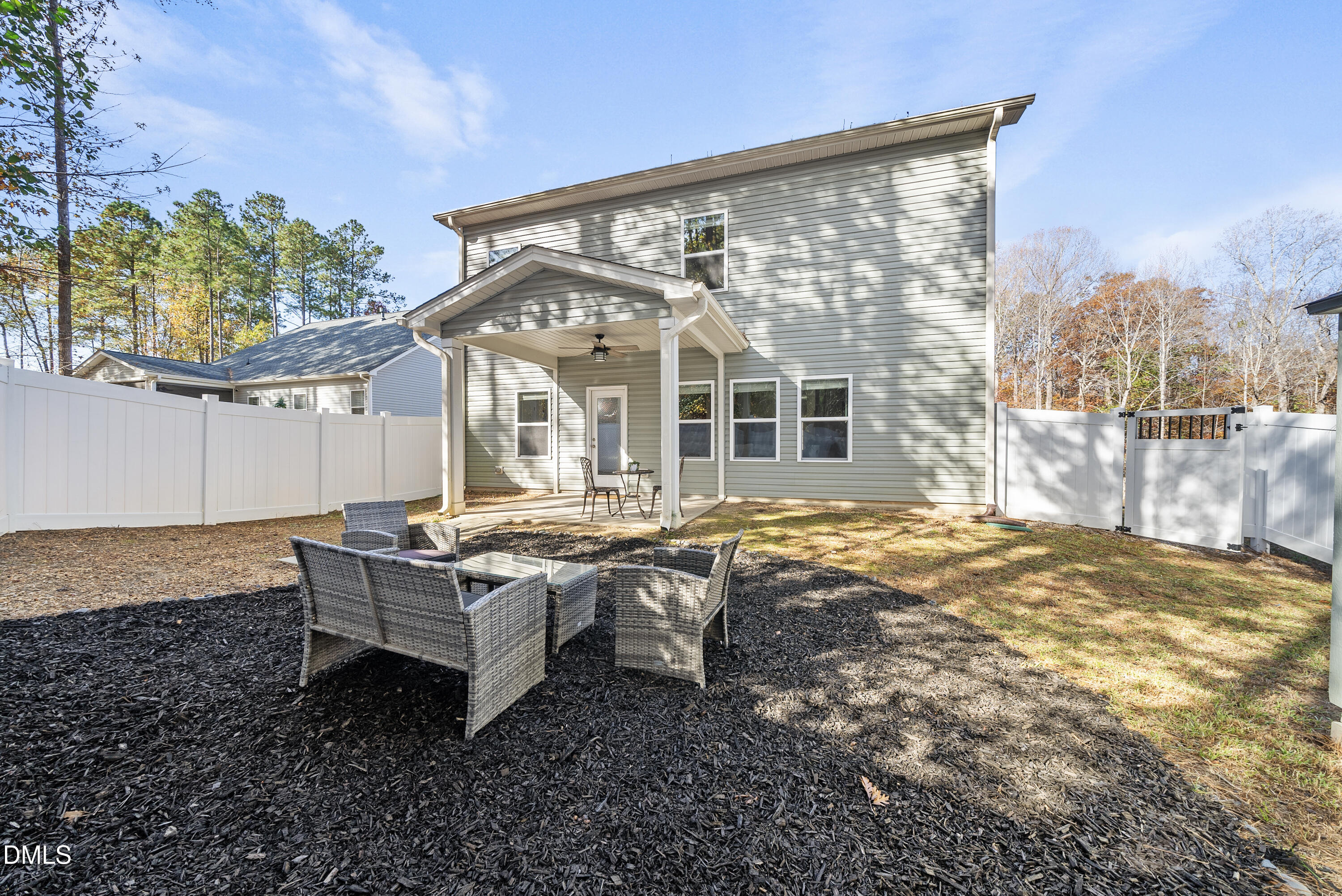 306 Springhill Lane Garner, NC 27529 - Photo 41 of 43 a house view with a sitting space and garden space