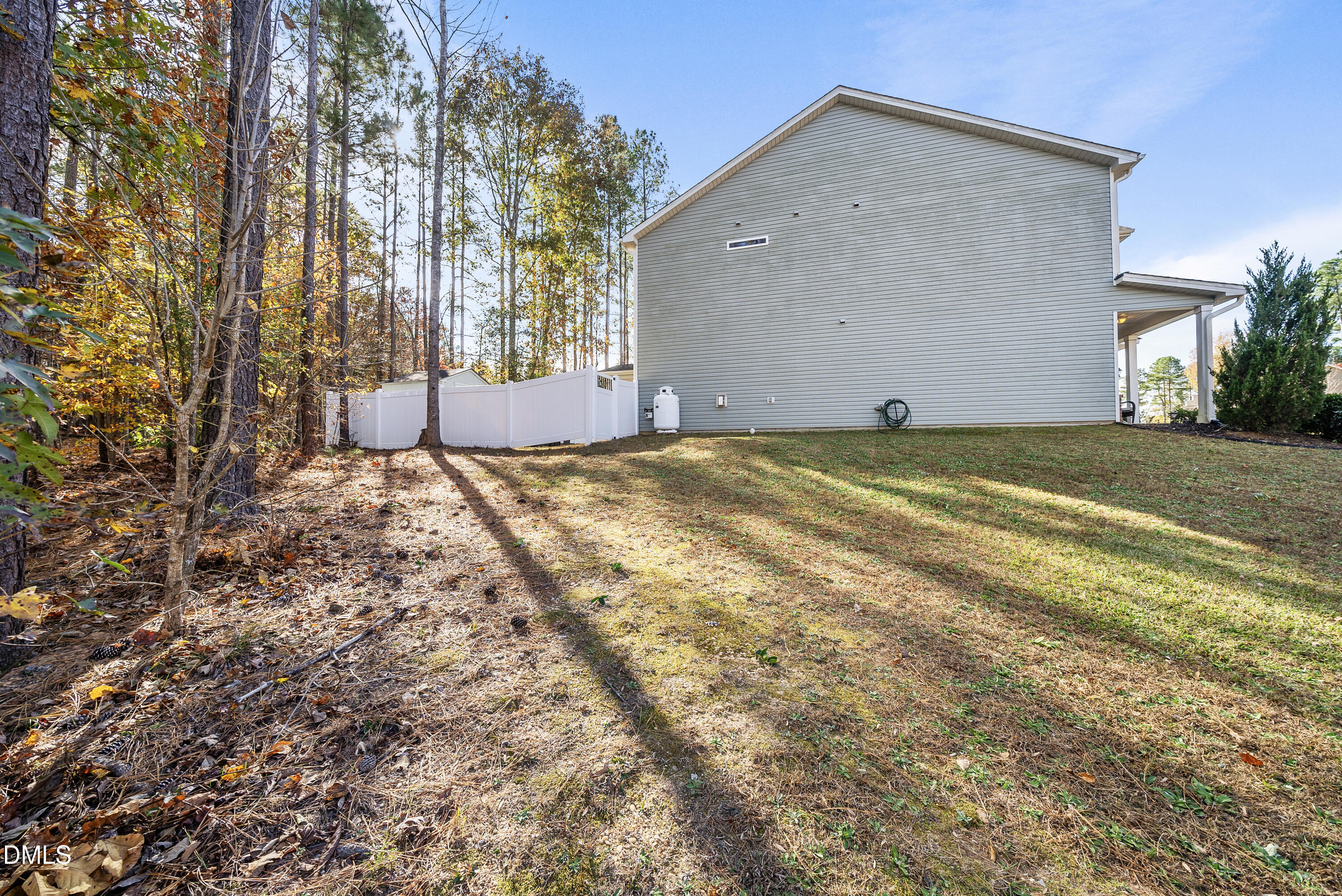 306 Springhill Lane Garner, NC 27529 - Photo 42 of 43 a view of a house with backyard and trees