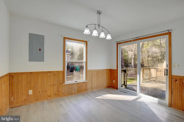 a bed sitting in a room next to a window