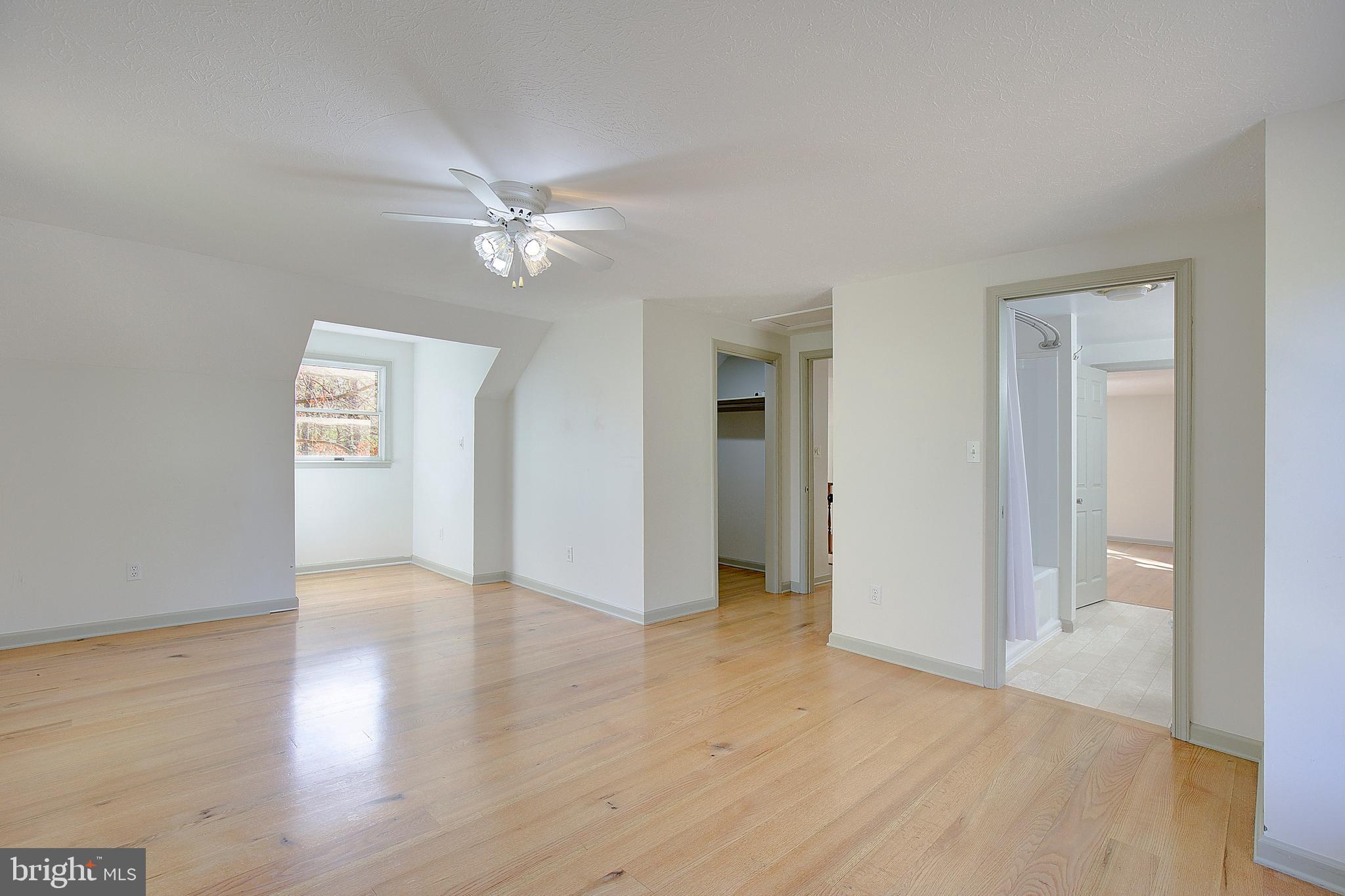 49220 Demko Road Lexington Park, MD 20653 - Photo 31 of 48 an empty room with wooden floor and ceiling fan