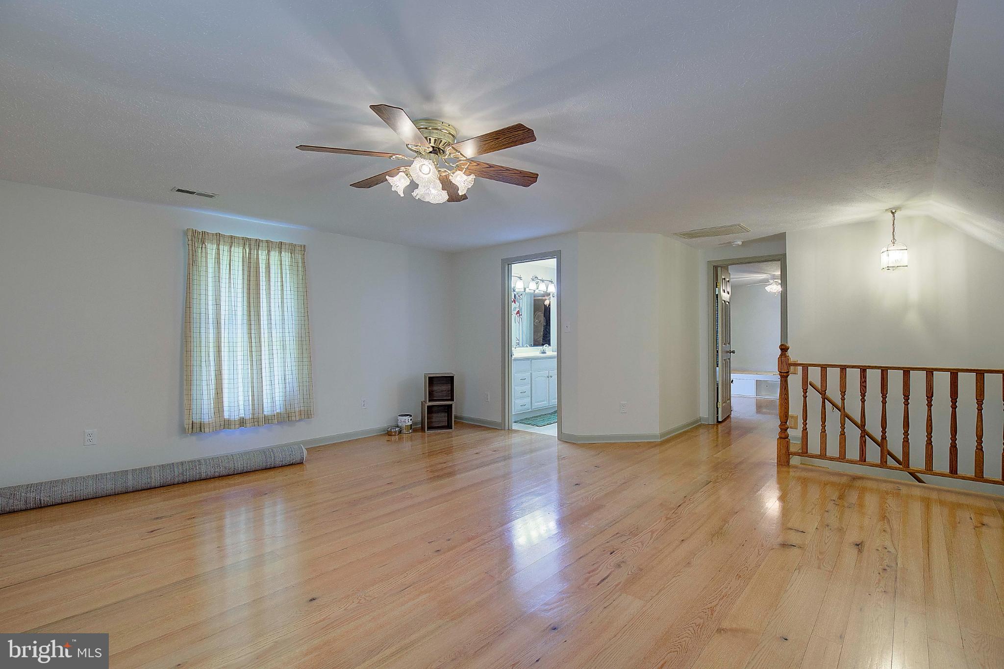 49220 Demko Road Lexington Park, MD 20653 - Photo 32 of 48 a view of an empty room with wooden floor and a window