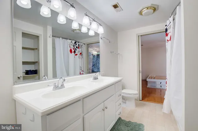 a view of a livingroom with wooden floor and a window