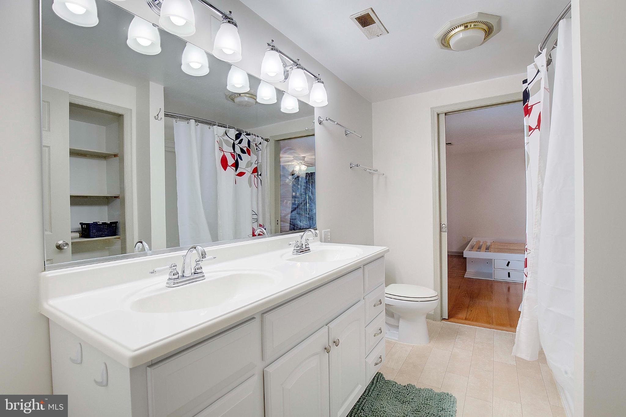 49220 Demko Road Lexington Park, MD 20653 - Photo 33 of 48 a bathroom with a sink a toilet and a mirror
