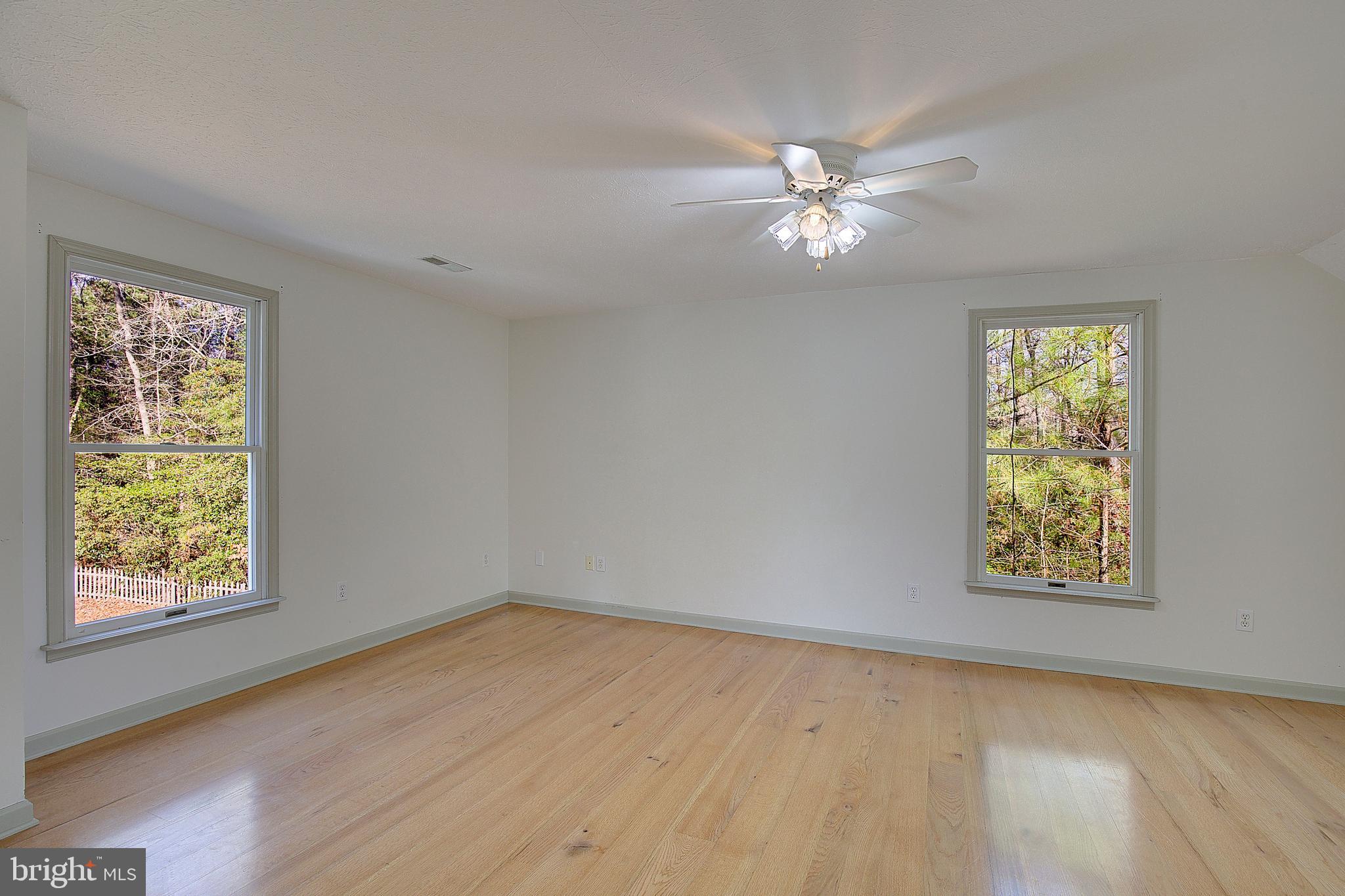 49220 Demko Road Lexington Park, MD 20653 - Photo 37 of 48 a view of an empty room with window and wooden floor