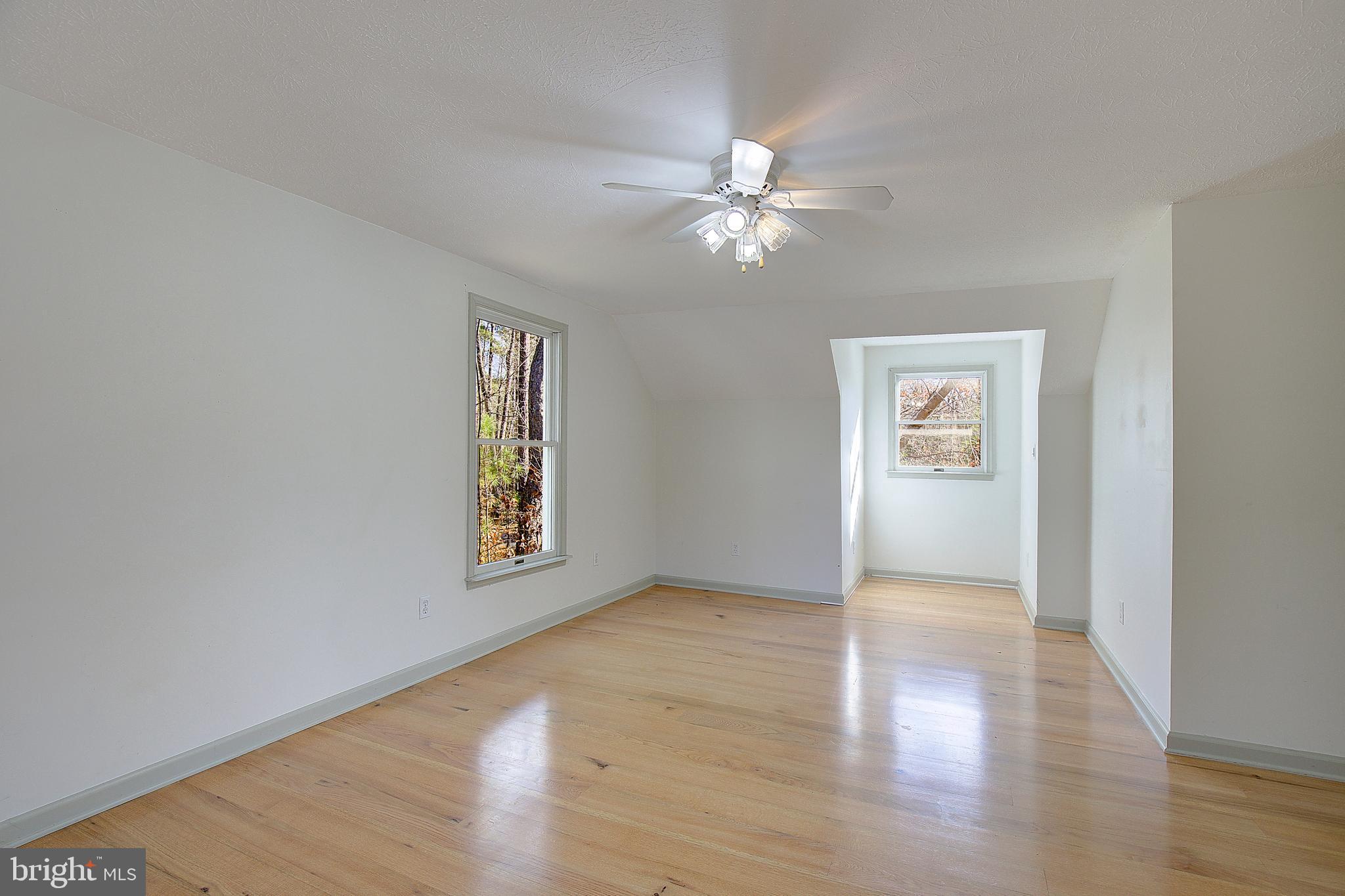 49220 Demko Road Lexington Park, MD 20653 - Photo 39 of 48 wooden floor in an empty room with a window