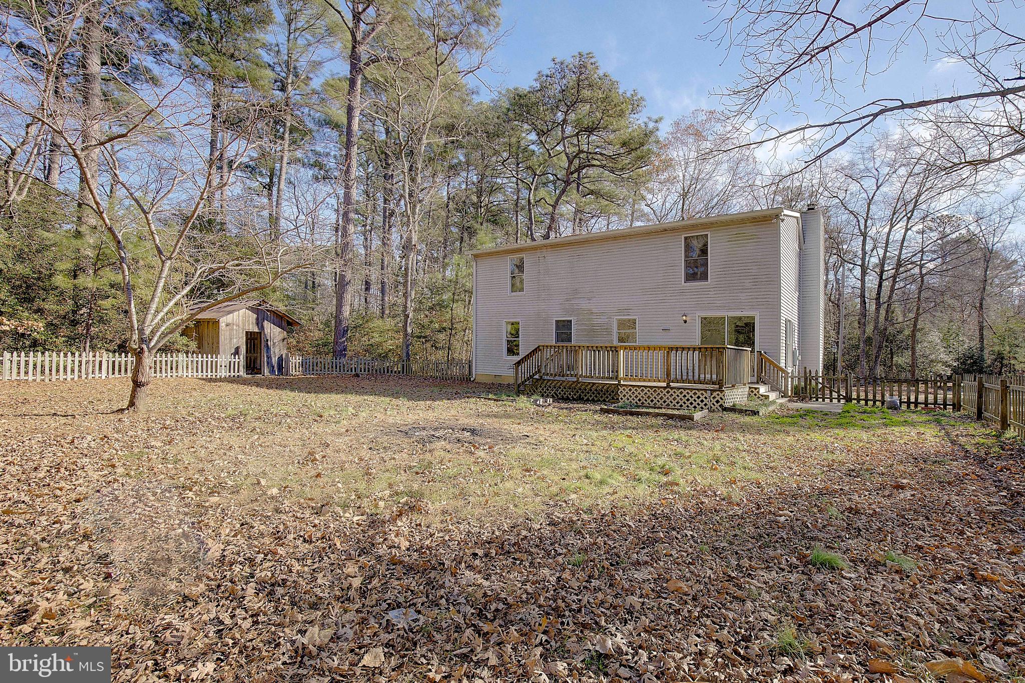 49220 Demko Road Lexington Park, MD 20653 - Photo 43 of 48 a view of a yard with a house and a tree
