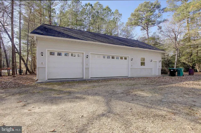 an empty room with a empty space and windows